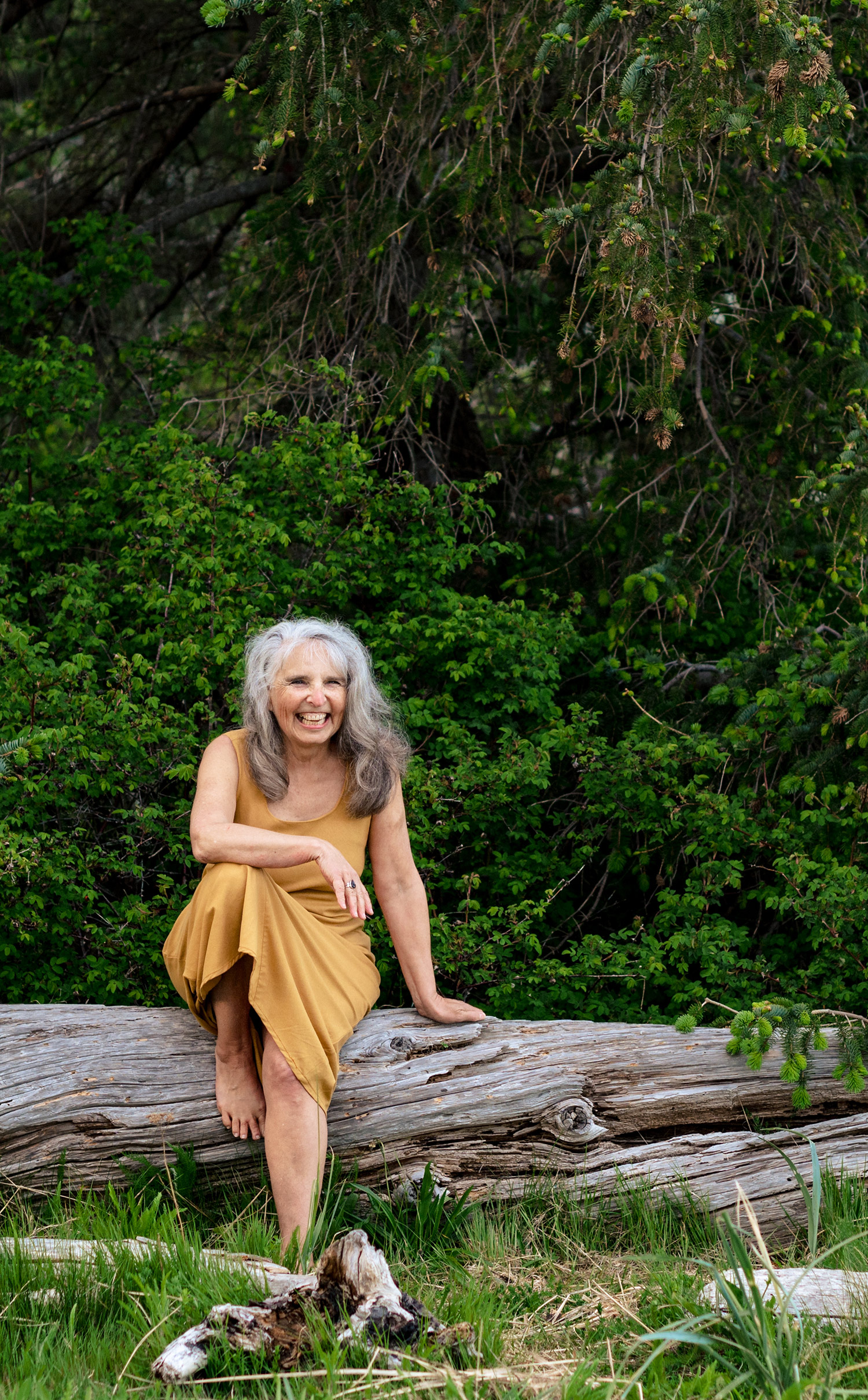 roberta sitting on log